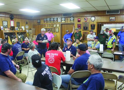 Mamou Fire Chief Garry Reed (center) explains the route and procedures during the water shuttle held Wednesday, October 5. The route went from the Mamou Fire Station to the Mamou rice driers on Old Highway 13. (Gazette photo by Tony Marks)