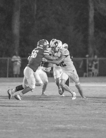 Basile’s William Ashford (56) goes head to head with a Rosepine Eagle during last week’s home opener. The Bearcats host Port Barre this week for Homecoming. (Photo by Tonya Ortego)
