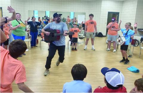 Joseph “Jo” Vidrine is pictured as he inspires youth musicians at Kids’ Camp in Eunice. (Photo by Zeta McCaskill)