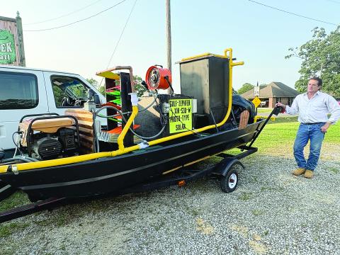 Chris Kalivoda shows off his new invention, the Gulf Zephyr, which is designed to lower water temperatures as a way of mitigating risks associated with hurricanes. (Gazette photo by Tony Marks)