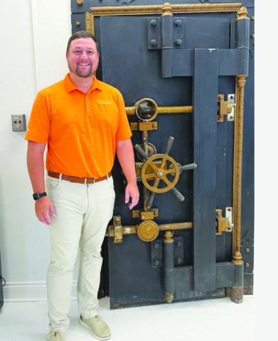 Chad Miller, CEO of Southwest Louisiana Credit Union, shows off the vault at the newly-remodeled city building on Main Street that now houses the new business. (Gazette photo by Heather Bogard)