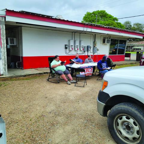The parking lot of Chunkie’s Drive-In was one of the twelve posts where the Bible was read by 70 locals on March 9. Some of those taking part are shown above.