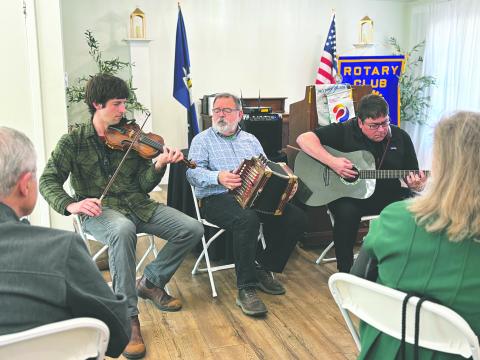 From left, are Colin Gould, John Vidrine and Kevin Huval (president of Louisiana Folk Roots) perform for Rotarians during the March 17, meeting of the Ville Platte Rotary Club. They also shared details on the upcoming Dewey Balfa Cajun and Creole Heritage Week, which will be held April 13-16 at Lakeview Park and Beach. (Gazette photo by Heather Bogard)