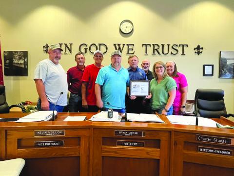 EPPJ RECEIVES BROADBAND INITIATIVE AWARD - During a special meeting held Wednesday, August 16, the Evangeline Parish Police Jury received a broadband initiative award. Shown, from left, are jurors Keith Saucier, Ryan Ardoin, vice president Kevin Veillon, president Bryan Vidrine, secretary-treasurer Chester Granger, and jurors Eric Soileau, Leila Thrasher and Angelica Williams. (Gazette photo by Heather Bogard)