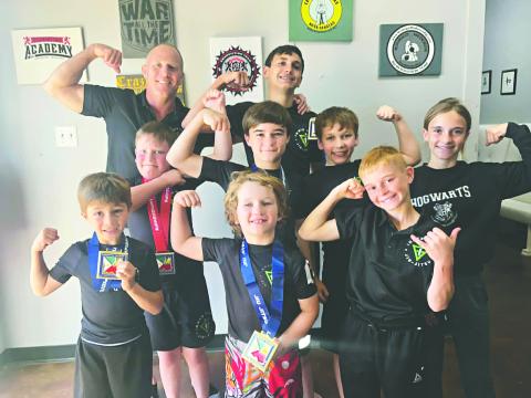 INNER GAME STUDENTS DO WELL IN TOURNAMENT - Several students from Inner Game Jiu-Jitsu participated in a tournament in Lafayette on Saturday, April 11, and had a great showing. Above, Coach Robbie Stevens (top left), Charlie and Leah Stevens (right) and students (in no particular order) Bodhi Vidrine, Oliver Sonnier, Jeremiah Trahan, Kason Castille, Easton Sonnier and Eli Lafleur share a celebratory photo. (Photo courtesy of Robbie Stevens)