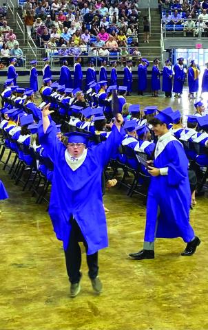 Brock Jordan jumps for joy after being declared a Sam Houston High grad. (Photo submitted)