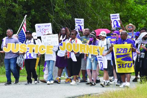 PROTESTORS MARCH AT LOCAL GEO DETENTION CENTER - Joseph Bryant, international executive director of SEIU (far left), was among the 300 that gathered on East Stagg Avenue in front of the local detainee center back in July of this year. (Photo by Robert Stewart, Verite News)