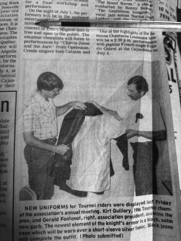 NEW TOURNOI UNIFORMS DISPLAYED - During the annual meeting of the Louisiana Tournoi Association in July 1987, 1986 Tournoi champion Kirt Guillory (left) and association president Gerald Fontenot (right) show off the new uniforms to be worn by the riders at the next Tournoi run later in the year. (Gazette archive photo)