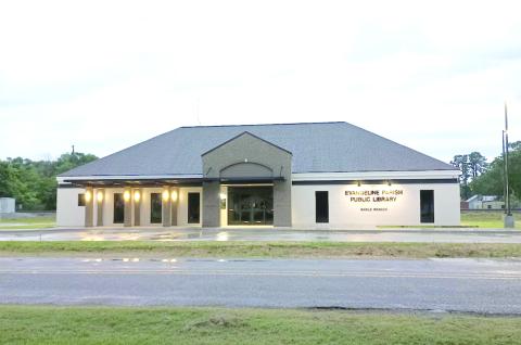 NEW LIBRARY LIGHTS UP -  This photo was taken recently at dusk as lights illuminate the new library in old downtown Basile, which will open to the public on Thursday, June 5, following a 9 a.m. ribbon-cutting ceremony.