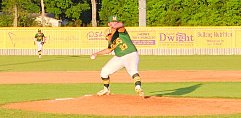 Wyatt Johnson (23) prepares to deliver a pitch in Mamou’s playoff series against Iowa.  (Gazette photo by Rhett Manuel)