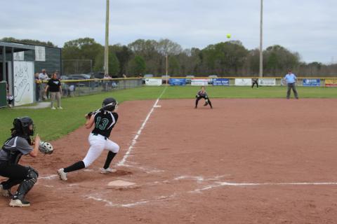 Maddie Fontenot (13) rips a base hit to left field in the Mamou Lady Demons’ 9-1 win over Church Point to improve to 11-5 on the season. (Gazette photo by Rhett Manuel)