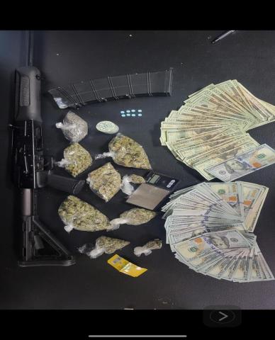 Pictured are a firearm, U.S. currency, and illegal narcotics which were seized following a recent arrest by the Evangeline Parish Sheriff’s Office. (Photo courtesy of EPSO)
