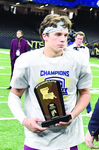 Jonathan Dartez holds his outstanding award trophy that he won after his Vermilion Catholic team won the LHSAA Football Division IV Select state championship. (Photo courtesy of Abbeville Meridional)