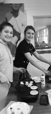 4-H PANCAKE WORKSHOP - 4-H members Lilly Stanfield, left, and Madison Courville, right, worked hard at the Pancake Workshop. (Photo courtesy of Kimberly Deville)