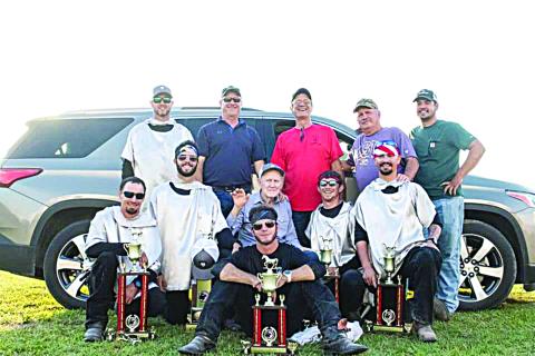FAMILY SURROUNDS ITS PATRIARCH - Winston Guillory, seated in the center, is surrounded by family at the 2020 Tournoi. Seated in front is John Ross Guillory. Kneeling in the second row, from left, are Alex Haller, Eric Guillory, Winston Guillory, Marcus Guillory, Ryan Haller, and Cody Guillory. Standing in back, from left, are Cody Guillory, Kent Guillory, Kirt Guillory, Keith Guillory and William Fontenot. (Photo submitted)