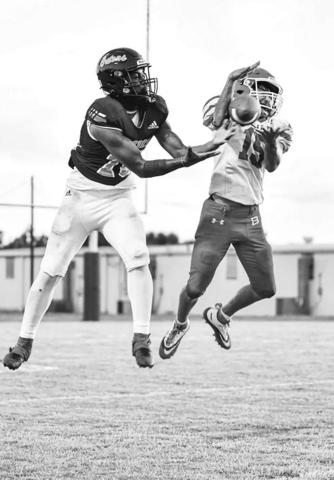 Bearcat Ricky Malone (15) battles a Beau Chene Gator for a pass possession. (Photo by Tonya Ortego)