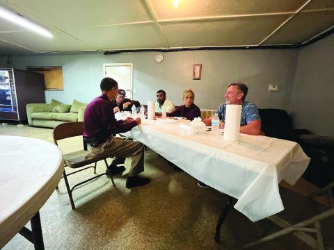Chief Pat Hall visits with, from left, council members Eugene Manuel and Ricardo “Reko” Goodley, Mayor Leisa Deshotel and council member Robin Young. (Gazette photo by Heather Bogard)