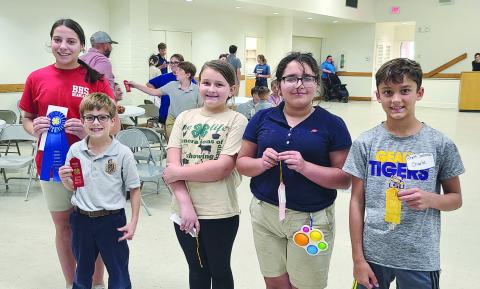 SEAFOOD COOKERY WINNERS - Shown, from left, are winners Anne Berzas (Basile eighth grade), first place; Andrew Bischoff, (Sacred Heart fourth grade), second place; Sophia Aucoin (Vidrine fifth), third place; 4th Gracelynn Derise (Mamou fourth grade); and Rhett Soileau, (Sacred Heart fifth grade), fifth place.