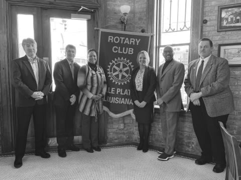 SLCC CHANCELLOR ADDRESSED ROTARY CLUB - Shown, from left, are Rotary President JImmy LeBlanc; Anthony Baham, interim vice president of workforce and economic development; Carleen Jones, C.B. Coreil campus director; Rotarian Nicole Wenger, Dr. June, and Dr. Charles Miller, associate vice chancellor of institutional effectiveness. (Gazette photo by Heather Bogard)
