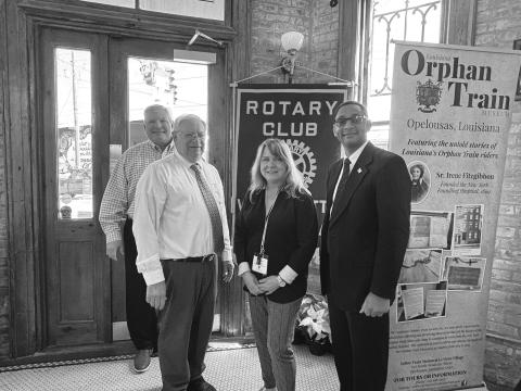 HISTORY OF ORPHAN TRAIN PRESENTED -  Shown, from left, are Rotarians Peter Strawitz, James Douget, Martha Aubert and Rotary President Brian Ardoin.Douget and Aubert with the Orphan Train Museum talked about the history of the Orphan Train. (Gazette photo by Heather Bogard).