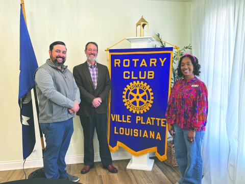 LIBRARY SERVICES SHARED - Keishia Ford, branch manager of the Ville Platte Main Branch of the Evangeline Parish Library, (right) visited the February 24, meeting of the Ville Platte Rotary Club. She is shown with, from left, Rotary President Beau Wilson and Rotarian Richard Lejeune. (Gazette photo by Heather Bogard)