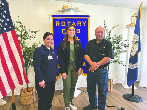 VACCINE INFORMATION SHARED - Morgan Hebert, a family nurse practioner at Mercy Regional Medical Center, (center) presented a brief talk on the importance of vaccines during the March 11, meeting of the Ville Platte Rotary Club. She is shown with Rotarian Ashlyn Ortego (left) and Rotary President Bob Manuel (right) (Gazette photo by Heather Bogard)