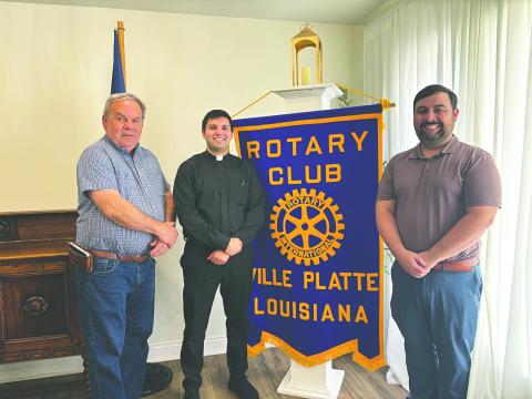 SEMINARIAN FORMATION DISCUSSED - Father Alex Lancon (center) was the guest speaker for the March 24, meeting of the Ville Platte Rotary Club. He is shown with Rotarian Steve Phillips (left) and Rotary President Beau Wilson (right). (Gazette photo by Heather Bogard)