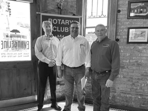 LATOUR DISCUSSES BUSINESS - Bart LaTour with Progressive Tractor addressed the March 29, meeting of the Ville Platte Rotary Club. He is shown with Rotary President Jimmy LeBlanc (left) and Rotarian Mitch Fontenot (center). (Gazette photo by Heather Bogard)