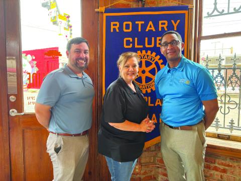 UPDATE GIVEN ON ACOSTA FOUNDATION -  Connie Acosta Lamke, center, gave an update on the Acosta Foundation’s upcoming events during the April 2, meeting of the Ville Platte Rotary Club. She is shown with Rotarian Beau Wilson, left, and Rotary President Brian Ardoin. (Gazette photo by Heather Bogard)
