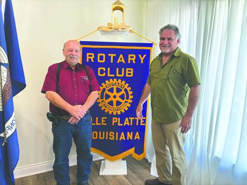 INFORMATION ON FORTIFIED ROOFS SHARED - Rotarian Eric Gil, during the April 15, meeting of the Ville Platte Rotary Club, shared information of the costs and insurance savings of fortified roofs for homeowners. He is shown with Rotary President Bob Manuel (left) (Gazette photo by Heather Bogard)