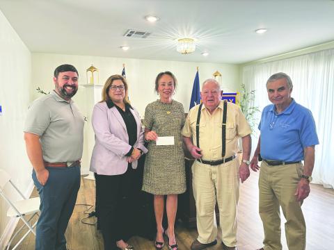 LSUE SCHOLARSHIP PRESENTED - During the April 28, meeting of the Ville Platte Rotary Club, Rotarian Dr. Willie Buller and Rotary President Beau Wilson presented the annual Ville Platte Rotary scholarship donation to the LSUE Foundation. Shown, from left, are Wilson, LSUE Foundation Executive Director Carey Lawson, LSUE Chancellor Dr. Nancee Sorenson, Dr. Buller, and Rotarian Dr. Kirk Soileau. (Gazette photo by Heather Bogard)