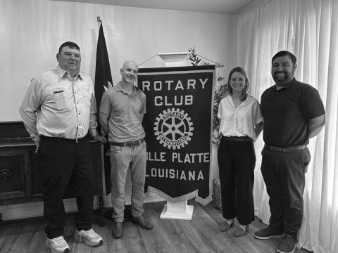 CHARM INDUSTRIAL SHARES UPDATE - During the May 6, meeting of the Ville Platte Rotary Club, members of Charmed Industrial addressed the group. Shown, from left, are Russell Marcantel, operations manager; Vince Green, chief development officer; Alison Kelman, community engagement officer; and Rotary President Beau Wilson. (Gazette photo by Heather Bogard)