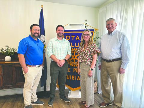 NEW BOOKSTORE TO OPEN IN VILLE PLATTE - Seth and Jessica Deen Norris (center) visited the May 12, meeting of the Ville Platte Rotary Club to share their journey to opening a new bookstore in town. Rotary President Beau Wilson (left) and Rotarian Peter Strawitz (right). (Gazette photo by Heather Bogard)