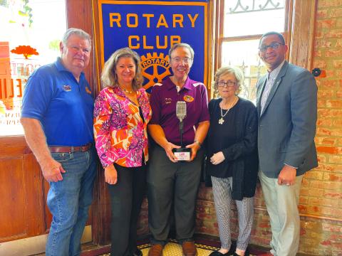 KVPI STAFF ADDRESSES GROUP -  Several staff members from KVPI spoke at the May 14, meeting of the Ville Platte Rotary Club to share the station’s history and unique format. Shown, from left, are KVPI staff members Mike Perron, Misty Parker (assistant manager), Mark Layne (general manager), Jackie Miller and Rotary President Brian Ardoin. (Gazette photo by Heather Bogard)