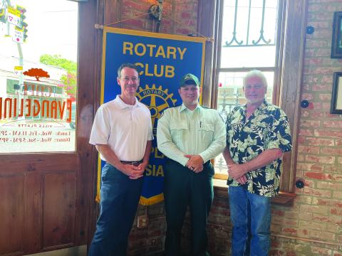 ACADIAN AMBULANCE SERVICES DISCUSSED - Jacques Dupre, center, visited the July 5, meeting of the Ville Platte Rotary Club to discuss his career with Acadian Ambulance. He is shown with Rotarian Richard Lejeune, left, and Rotary President Larry Lachney, right. (Gazette photo by Heather Bogard)