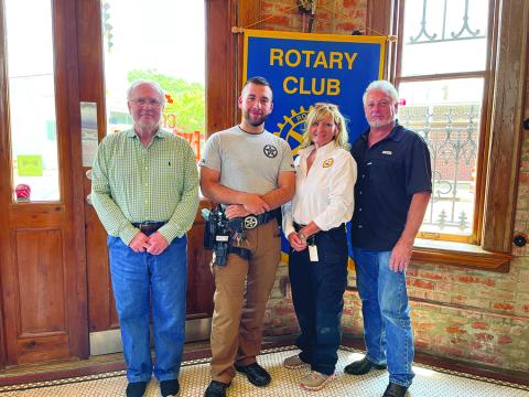 MARSHAL OFFICE DUTIES DISCUSSED - Ville Platte City Marshal Nicole Snoddy (second from right) and deputy Aaron Clark (second from left) visited the July 12, meeting of the Ville Platte Rotary Club to discuss the workings of the city marshal’s office. They are shown with Rotarian Ronnie Landreneau (left) and Rotary President Larry Lachney (right). (Gazette photo by Heather Bogard)