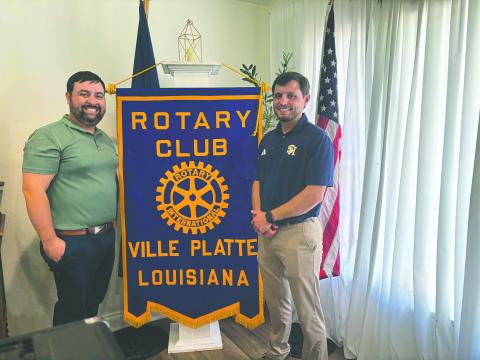 AGUILLARD DISCUSSES TROJAN FOOTBALL - Sacred Heart Athletic Director and head football coach Jacob Aguillard (right), addressed the July 15, meeting of the Ville Platte Rotary Club to discuss the upcoming football season. He is shown with Rotary President Beau Wilson (left). (Gazette photo by Heather Bogard)