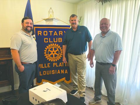 STATE OF AGRICULTURE DISCUSSED - Farm Bureau President Richard Fontenot discussed agriculture during the July 29, meeting of the Ville Platte Rotary Club. He is shown with Rotary President Beau Wilson (left) and Rotarian Dr. Hosea “Joey” Soileau (right). (Gazette photo by Heather Bogard)