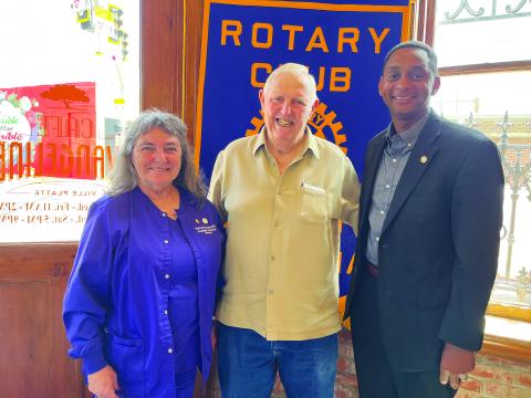 HILL DISCUSSES VFW - VFW Post #3803 Quartermaster Hillery Hill (center) visited the August 1, meeting of the Ville Platte Rotary Club as the guest of Rotarian Patricia Duplechin (left). They are shown with Rotary President Brian Ardoin (right). (Gazette photo by Heather Bogard)