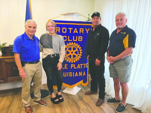 HISTORY SHARED - Tournoi rider and board member of the Louisiana Tournoi Association Bryan Fontenot visited the September 1, meeting of the Ville Platte Rotary Club to talk about the upcoming annual running of the Tournoi. Shown, from left, are Rotary President Dr. Kirk Soileau, Darrelyn Lachney (2014 Teen Tournoi Queen and 2012 Junior Tournoi Queen), Fontenot and Rotarian Larry Lachney (2014 Cotton Festival parade marshal). (Gazette photo by Heather Bogard)