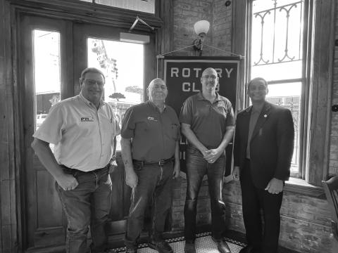 PTI TRAINING SCHOOL OPENED - Jarrod Schendel and Aaron Lemoine with PTI discussed the new service technician training school recently opened by PTI. From left are Rotarian Mitch Fontenot, Lemoine, Schendel and Rotary President Brian Ardoin. (Gazette photo by Heather Bogard)