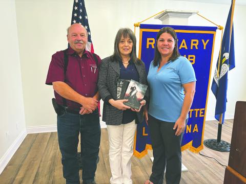 LAWSON SHARES JOURNEY AS AUTHOR - Local author Debby Lawson visited the October 8, meeting of the Ville Platte Rotary Club to discuss the publication of her latest book. She is shown with Rotary President Bob Manuel (left) and Rotary Secretary Kristi Enicke (right). (Gazette photo by Heather Bogard)