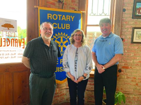 DEEN VISITS WITH VP ROTARY CLUB - Rotarian Dan Poret, left, welcomed Lisa Deen, center, as the guest speaker for the October 12, meeting of the Ville Platte Rotary Club. They are shown with Rotary President Jimmy LeBlanc, right. (Gazette photo by Heather Bogard)