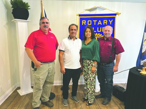 FREEDOM CENTER DISCUSSED - Pastor Steven Sawtelle and his wife, Sarahi, visitied the October 22, meeting of the Ville Platte Rotary Club to talk about their recently opened Freedom Center. Shown, with the couple are Rotarian Scott Smith (left) and Rotary President Bob Manuel (right). (Gazette photo by Heather Bogard)