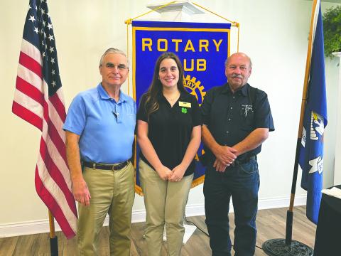 4-H OPPORTUNITIES SHARED - Evangeline Parish 4-H Agent Madison Latour visited the November 5, meeting of the Ville Platte Rotary Club. She is shown with Rotarian Dr. Kirk Soileau (left) and Rotary President Bob Manuel (right). (Gazette photo by Heather Bogard)