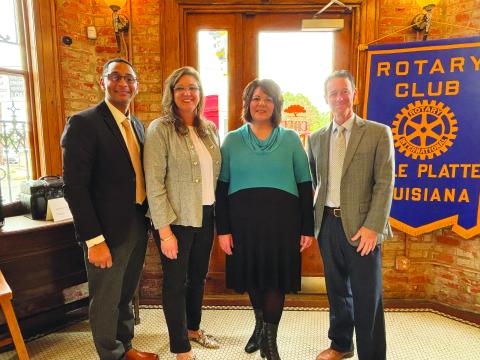 UPDATE GIVEN ON REIMAGINE ACADEMY -  Alice LeJeune and Liz Chatelain with Reimagine Academy addressed the November 21, meeting of the Ville Platte Rotary Club. Shown, from left, are Rotary Club President Brian Ardoin, LeJeune, Chatelain and Rotarian Richard LeJeune. (Gazette photo by Heather Bogard).