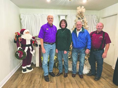 SUCCESSFUL CRAWIFISH SEASON PREDICTED - Mark Shirley visited the December 3, meeting of the Ville Platte Rotary Club to discuss the upcoming crawfish season. From left are Shirley, his wife, Rebecca Shirley, Rotarian Dr. William “Tojo” Ward and Rotary President Bob Manuel. (Gazette photo by Heather Bogard)