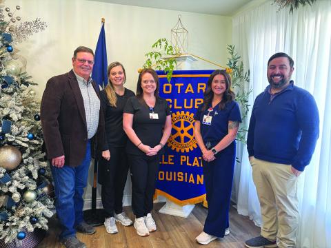 IN-PATIENT REHAB BENEFITS SHARED - Shown, from left, are Rotarian Mitch Fontenot, Sara LaFleur, Tiffany Leger, Kayla Stelly and Rotary President Beau Wilson. (Gazette photo by Heather Bogard)