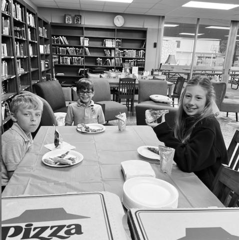From left, are Merritt Deville, Everett Fontenot and Audrey Caulkins. They enjoyed pizza in the library as they were among the top accelerated readers for the first nine weeks. (Photo courtesy of Jan Veillon)