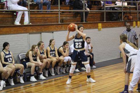Kali Shiver (22) sets up a play for her Lady Trojans in Sacred Heart’s 47-46 road loss to Opelousas Catholic Tuesday night. (Gazette photo by Rhett Manuel)